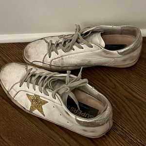Low top gold star golden goose sneakers.